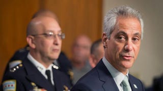 Interim Chicago Police Superintendent John Escalante (left) listens as Chicago Mayor Rahm Emanuel addresses changes in training and procedures that will take place at the Chicago Police Department in the wake of recent shootings on Dec. 30, 2015, in Chicago. Scott Olson/Getty Images