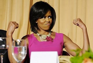 First Lady Michelle Obama flexes her famous "guns."