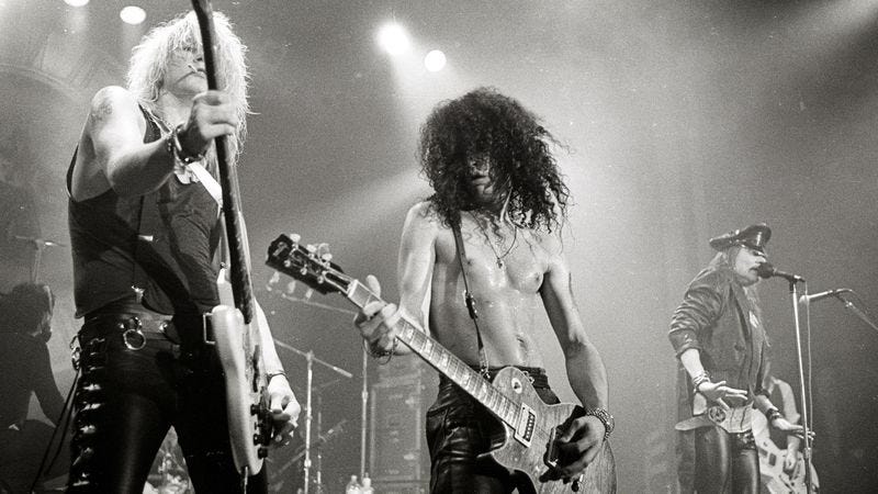 A statistically significant portion of Guns N' Roses, playing together in 1988. (Photo: Getty Images)