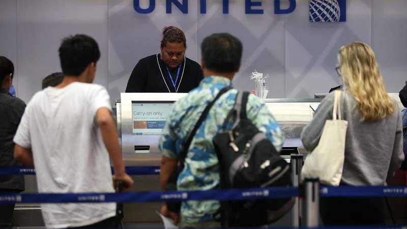 At United, that human touch begins at the counter and doesn't end until you're forcibly removed from your seat. (Photo: Justin Sullivan/Getty)