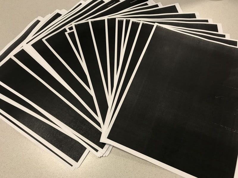 Chuck Raasch of the St. Louis Post-Dispatch took this photo of the documents he received from the U.S. Department of Justice Office of Community Oriented Policing Services in response to a Freedom of Information Act request. The documents were totally redacted. (Chuck Raasch/St. Louis Post-Dispatch)