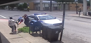 Officer Nathan Blanford opens fire as Deng Manyoun swings a flagpole in his direction.USA Today