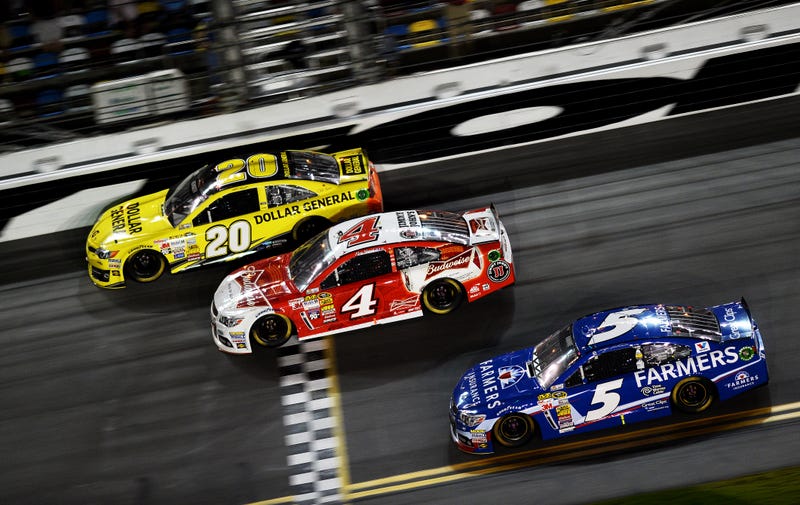 Drivers cross the finish line of the NASCAR Sprint Cup Series Budweiser Duel 1 race at Daytona International Speedway on Feb. 20, 2014, in Daytona Beach, Fla.Jared C. Tilton/Getty Images