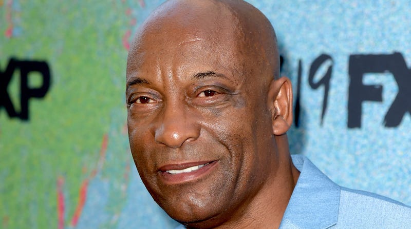 John Singleton arrives at the premiere of FX’s “Snowfall” Season 2 on July 16, 2018 in Los Angeles, California.