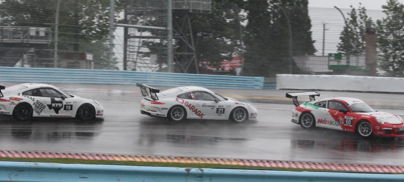 Illustration for article titled Standing Water Causes Mass 911 GT3 Cup Spin-Out At First Turn Of Race