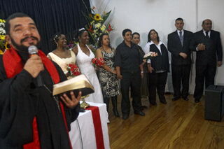 A priest conducts a collective marriage ceremony of LGBT couples (Getty Images)