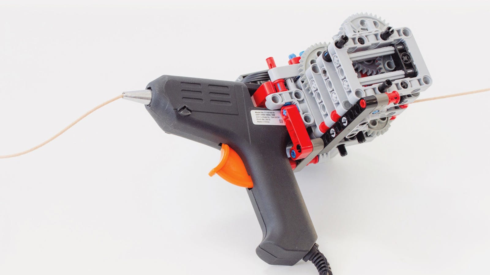This Lego-Modded Glue Gun is A Handheld 3D Printer