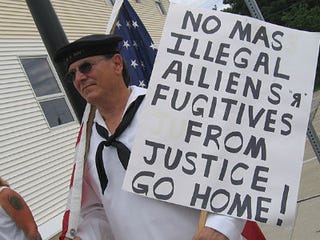 A man protests against illegal immigration. (Minnesota Public Radio)