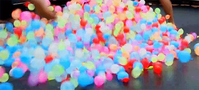 Bouncing On a Trampoline With Water Balloons Is the Best Way to Feel Like a Kid Again
