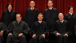 Members of the U.S. Supreme Court pose for photographs in the East Conference Room at the court building Oct. 8, 2010 in Washington, D.C.Chip Somodevilla/Getty Images