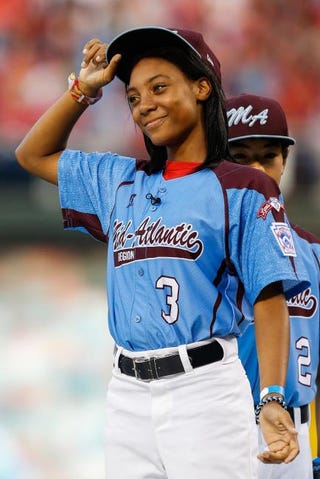 Mo’ne Davis tips her hat as she is introduced and recognized before the game between the Washington Nationals and the Philadelphia Phillies at Citizens Bank Park on Aug. 27, 2014, in Philadelphia.Brian Garfinkel/Getty Images