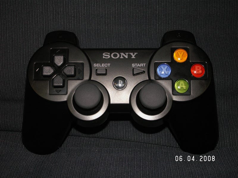 An Xbox 360 Controller Crammed into a PS3 Dual Shock Controller's Body