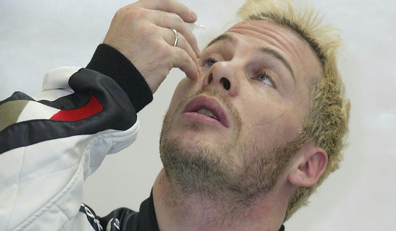 One of Jacques Villeneuve’s more successful post-championship moments: putting in an eyedrop. Photo credit: Mark Thompson/Getty Images