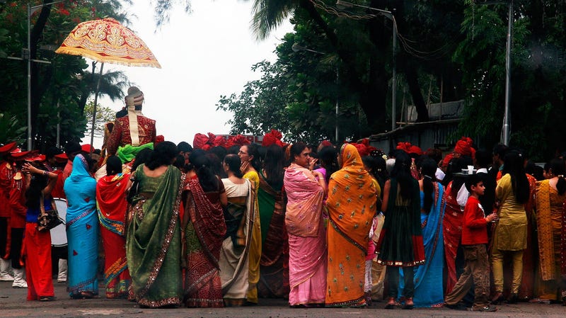 A wedding procession takes place a few hundred meters away from the Dadar Crematorium on November 30, 2008 in Mumbai (Bombay), India.