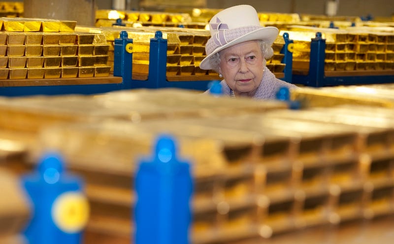 Queen Elizabeth inspecting stacks of gold at the Bank of England, which doesn’t actually have anything to do with Canadian currency, but is just kind of funny to look at (Photo by Eddie Mulholland - WPA Pool/Getty Images)
