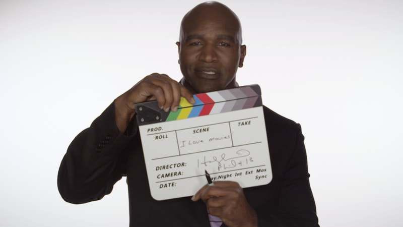 Evander Holyfield smiles warmly as he thinks of all the movies that are out there.
