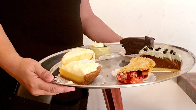 Waitress Parades Choice Of Pie Slices In Front Of Man Like Madam In High-Class Brothel