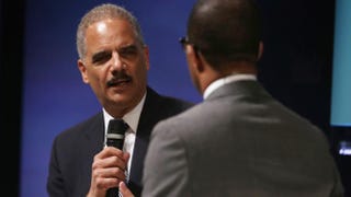 Attorney General Eric Holder speaks as columnist Jonathan Capehart looks on during a session at the sixth annual Washington Ideas Forum, hosted by the Aspen Institute and The Atlantic, Oct. 29, 2014, in Washington, D.C. Alex Wong/Getty Images