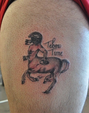 Illustration for article titled Somebody In Denver Got This Awful "Tebow Time" Centaur Tattoo On His Thigh