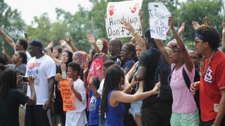 Demonstrators protest outside the Ferguson Police Department in Missouri during the National March on Ferguson Aug. 30, 2014.Michael B. Thomas/AFP/Getty Images