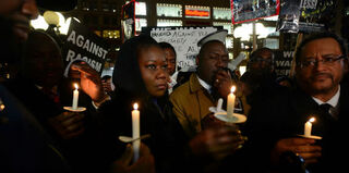 Sybrina Fulton, Benjamin Crump and Michael Eric Dyson at the candlelight vigil for Trayvon Martin (Emmanuel Dunand/AFP/Getty)
