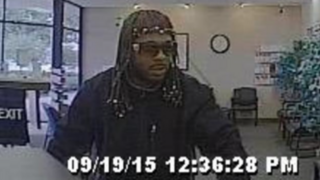Surveillance footage from the Indiana Members Credit Union shows one of the suspects who reportedly robbed the bank wearing full Rick James braids. ABC 6 screenshot