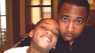 Writer Keith Reed, with his youngest son, Elijah.