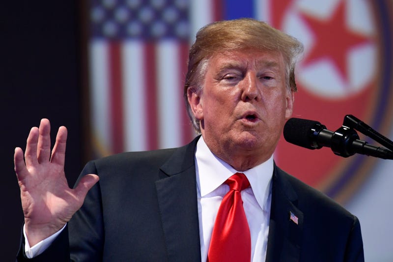 President Donald Trump answers press questions at a 2018 summit with North Korea leader Kim Jong Un.