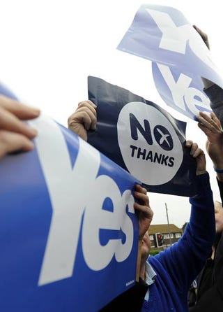 Pro-union (center) and pro-independence campaigners jostle for space during a pro-independence rally in Glasgow, Scotland, on Sept. 12, 2014.Andy Buchanan/AFP/Getty Images