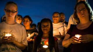Mourners celebrate Trayvon Martin's life at a vigil. (Andrew Burton/Getty Images)