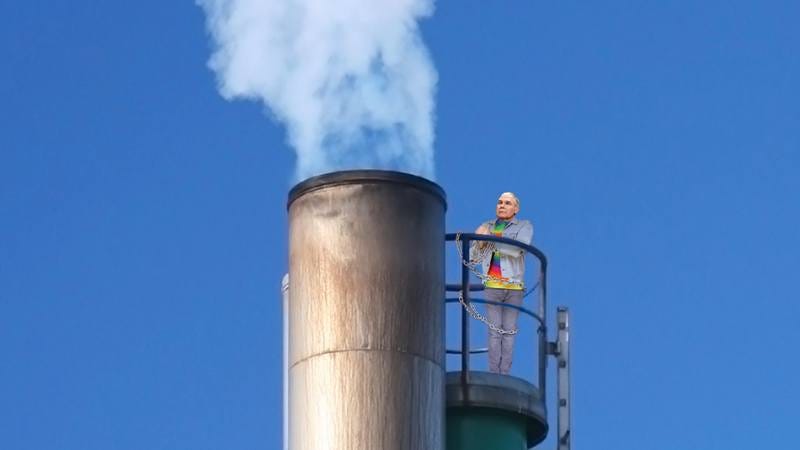EPA head Scott Pruitt chained to a smokestack.