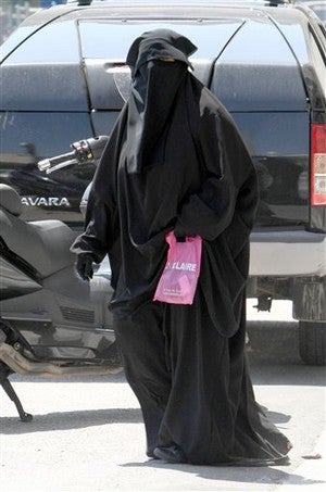 Illustration for article titled France May Ban The Burqa • Couple With Swine Flu Weds