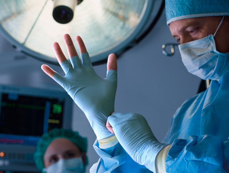 Badass Surgeon Puts On Fingerless Latex Gloves Before Operating