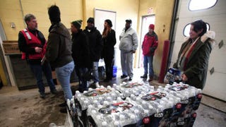 Flint residents line up to get bottled water, water testing kits and water filters at a Flint Fire Station Jan. 13, 2016, in Flint, Mich. Bill Pugliano/Getty Images