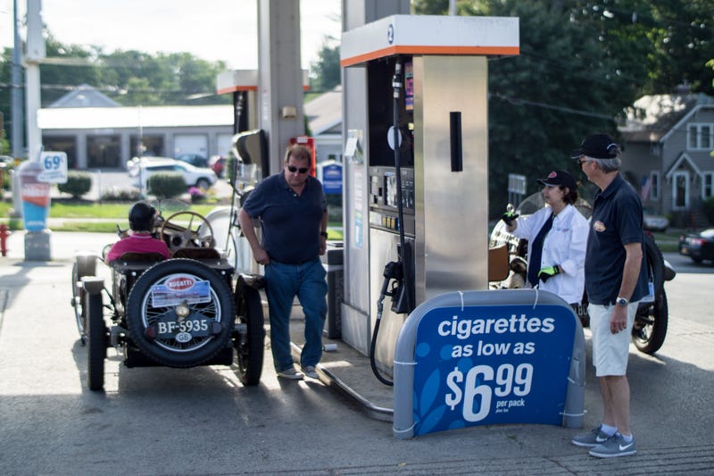I was only able to snap this 1 lousy photo on the way to work, but how often do you see vintage race cars at the pump?