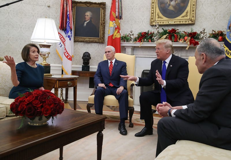 Donald Trump (2R) argues about border security with Senate Minority Leader Chuck Schumer (D-NY) (R) and House Minority Leader Nancy Pelosi (D-CA) as Vice President Mike Pence sits nearby in the Oval Office on December 11, 2018 in Washington, DC.