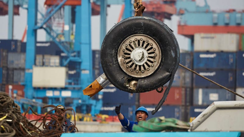 The wrecked landing gear of Lion Air Flight JT 610 is unloaded from a ship at the Tanjung Priok port on November 3, 2018 in Jakarta, Indonesia.