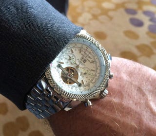 Illustration for article titled Kliff Kingsbury's Swaggy And Expensive-Looking Watch Is Probably Fake
