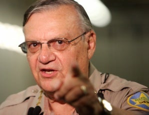 Sheriff Arpaio has three fingers pointing back at himself. (Google)