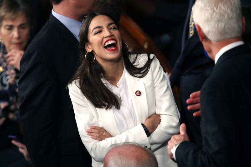 Rep. Alexandria Ocasio-Cortez (D-NY) talks to fellow members of Congress during the first session of the 116th Congress at the U.S. Capitol January 3, 2019 in Washington, DC.