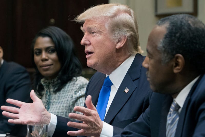 President Donald Trump with Omarosa Manigault (left) and Ben Carson (right) in the Roosevelt Room of the White House on Feb. 1, 2017 (Michael Reynolds-Pool/Getty Images)