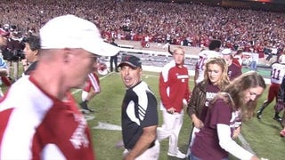 Illustration for article titled Did Nebraska Defensive Coordinator Carl Pelini Rough Up A Texas A&M Photographer? (Updated With Video)