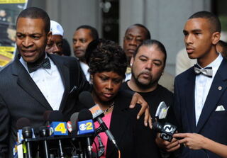 Wanda Johnson, Grant's mother, mourns her son. (Getty)