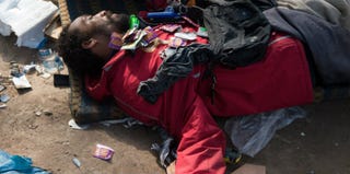 An alleged crack addict sleeps at a "crackland" near Parque Uniao in Rio de Janeiro (Christophe Simon/AFP/Getty Images)