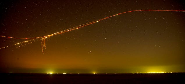 photo of Look at the Graceful Path of an Attack Helicopter as It Spits Fire image