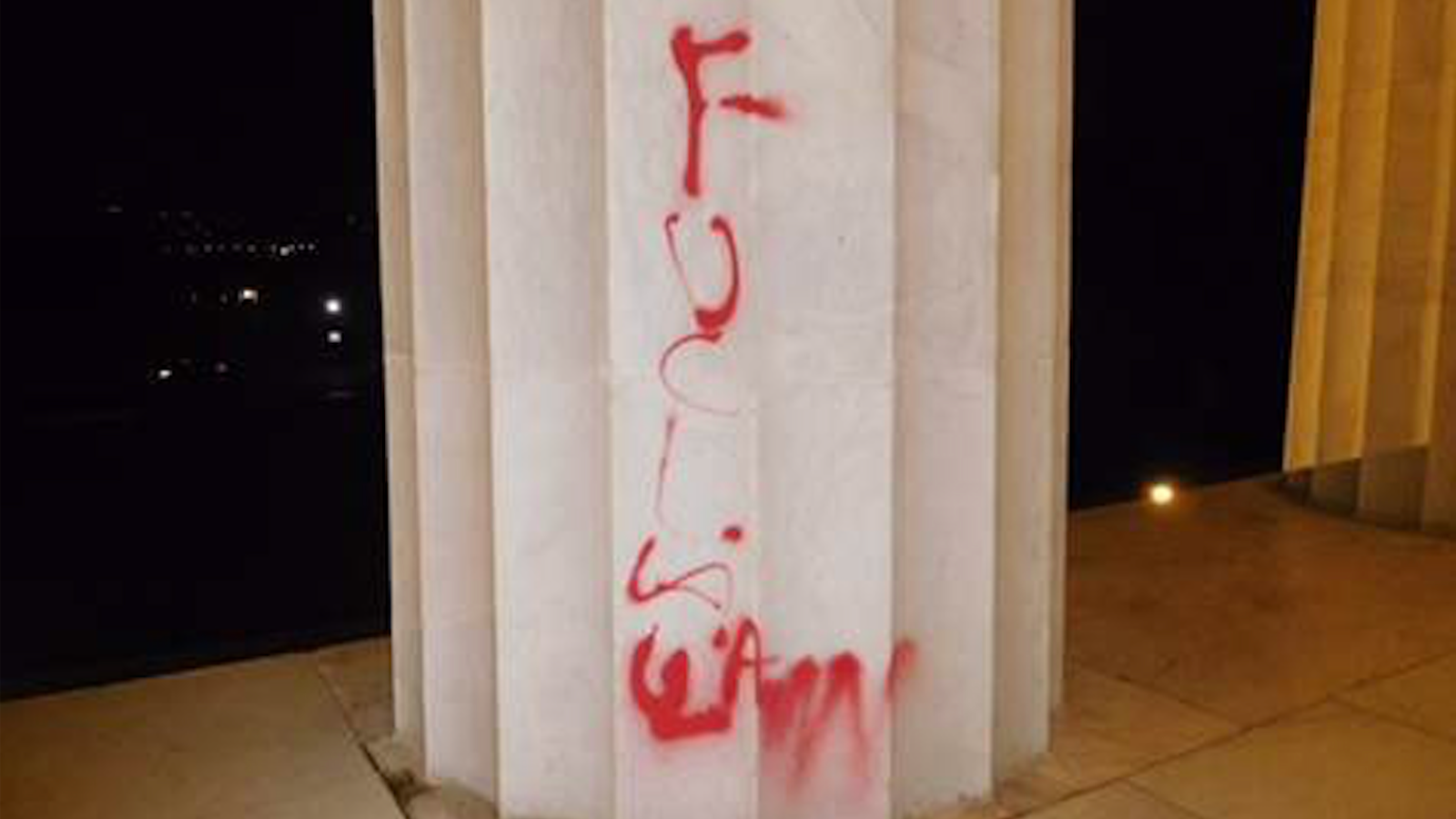 photo of What Do You See: This Lincoln Memorial Graffiti Is Either Islamaphobic or Anti-Police  image