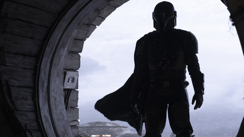 The Mandalorian enters.