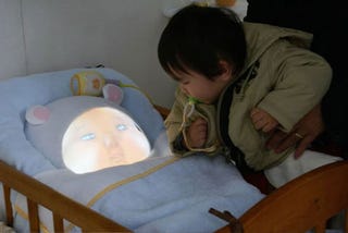 Illustration for article titled Japanese Baby Simulator Is 1,000 Times Creepier Than a Normal Baby