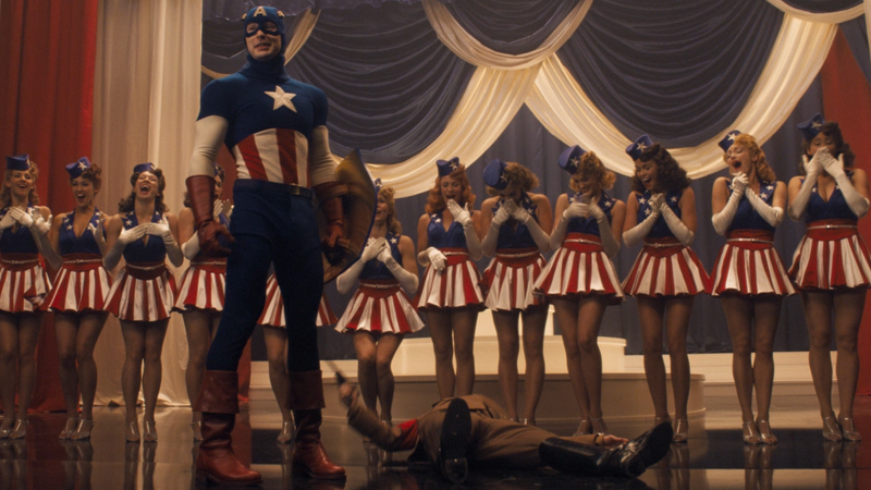 While Iron Man was turning Tony Stark into a modern day tech bro and Thor explained away magical gods with science and aliens, The First Avenger put Chris Evans in a goofy-ass retro costume and had him punch Hitler mid-showtune. YOUR FAVE COULD NEVER.