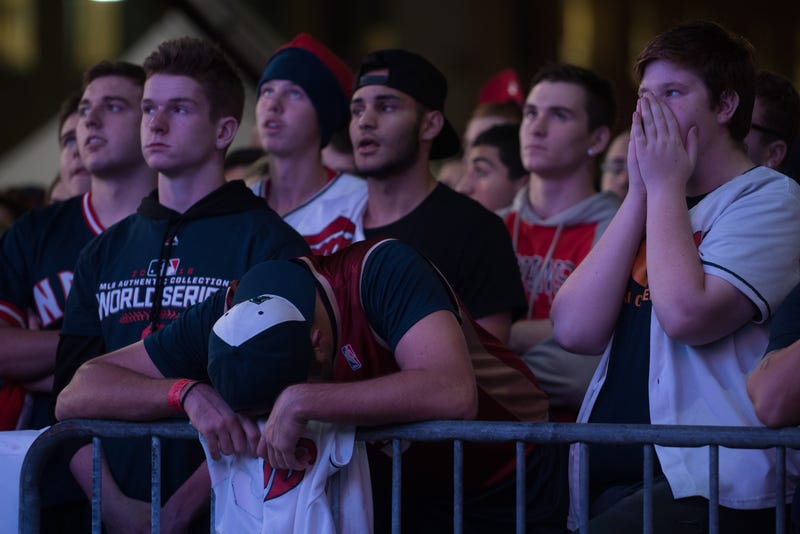 Fans react as they watch a big screen outside Progressive Field during Game 7 of the World Series between the Cleveland Indians and the Chicago Cubs in the early-morning hours of Nov. 3, 2016, in Cleveland. The Cubs defeated the Indians 8-7 in 10 innings to win their first World Series championship in 108 years.Justin Merriman/Getty Images
